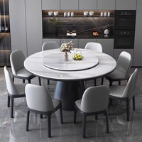 Table à manger ronde moderne de luxe avec plateau en pierre frittée brillante et base en forme de tambour pour meubles de villa haut de gamme.