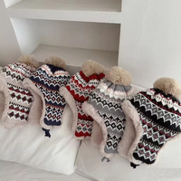 Chapeau d'hiver tricoté personnalisé à motif jacquard Fair Isle avec cache-oreilles, doublure en fausse fourrure épaisse et pompon, pour femme, vente en gros