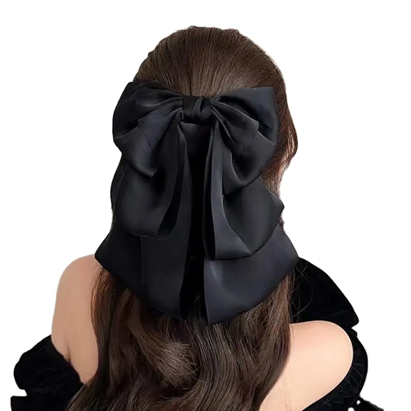 नया आगमन कोरिया स्टाइल स्प्रिंग सिंपल फैशन बिग बो हेयर क्लिप्स काले रंग की महिलाओं के लिए सुरुचिपूर्ण हेयर क्लिप्स लंबी लटकन