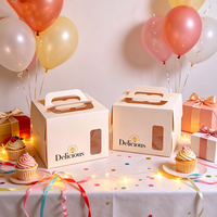Boîte à gâteau tendance 2026 en carton blanc écologique avec poignée et fenêtre transparente en PET, emballage alimentaire de qualité pour pâtisserie et desserts