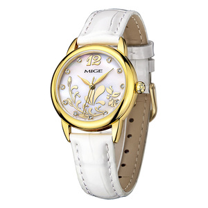 Montre à quartz élégante pour femme MIGE, couleur or, avec bracelet en cuir blanc et accents de diamants, cadran analogique - Product Image 1