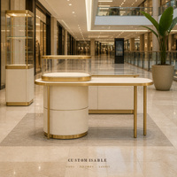 Table de présentation de bijoux sur mesure, vitrine en verre avec bordure dorée et éclairage LED pour magasin de détail et distributeur en gros