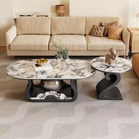 Table basse convertible moderne de luxe léger avec plateau en ardoise et structure en acier, design minimaliste pour salon