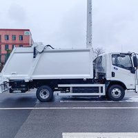 Camion compacteur de déchets électrique grande capacité BY-YS12000 12 tonnes, 12 m³, véhicule de collecte des ordures à chargement arrière EV, zéro émission