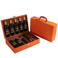 Boîte à vin en carton orange avec emblème étoile en relief et vernissage personnalisé pour l'emballage de spiritueux de marque (recyclable et écologique)