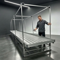 Grand banc roulant hydroponique à rail en V, système d'irrigation par flux et reflux multi-niveaux, pour agriculture en serre mobile