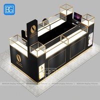 Comptoir de parfum en verre Armoire de présentation verrouillable avec cadre en acier inoxydable Support de parfum d'accent doré Meubles de magasin de détail