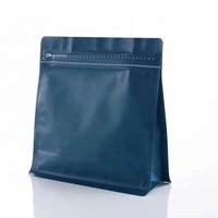 Emballage écologique en étain à fond plat, sachets d'emballage de grains de café compostables personnalisés avec valves et fermetures éclair.
