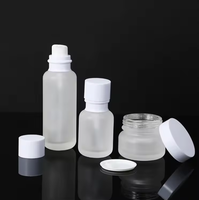 Vente en gros d'ensembles d'emballages en verre personnalisés, flacon en forme de bouteille de lait, flacon en verre cylindrique de 50 ml, pompe à lotion, flacon d'huile essentielle