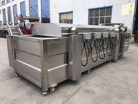 Friteuse industrielle entièrement automatique à cuisson continue pour la production de chips, d'arachides, de nuggets de poulet et de snacks