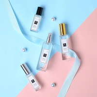 Botol Roll on kaca bening persegi kosong 5ml 10ml dengan tutup hitam emas rol baja tahan karat untuk parfum minyak esensial