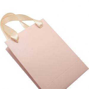 Sac en papier pour le shopping au design élégant, lignes fluides et couleurs vives - Product Image 1