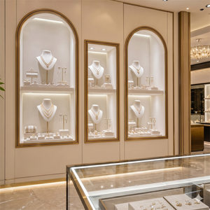 Vitrine à bijoux de luxe, design en arc, murale, en <span class=keywords><strong>verre</strong></span>, cadre or <span class=keywords><strong>champagne</strong></span>, niche à bijoux sur mesure pour les milieux haut de gamme - Product Image 1
