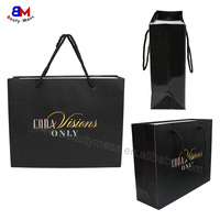 Sac en papier noir réutilisable de luxe avec poignée pour emballage de vêtements, cadeaux et achats professionnels, personnalisable et durable