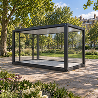 Serre en verre préfabriquée, pièce de jardin modulaire avec structure en acier et murs vitrés pour usage extérieur