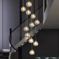 Lustre moderne en forme de sphère en cristal, grand et long, en spirale, pour la décoration de l'escalier d'un hôtel ou d'une villa, pour hall à haut plafond
