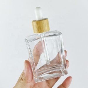 Hot Selling Cosmetic Rectangular <b>Bottle</b> Pink Silk Screen logo 50ml 100ml Essential Oil <b>Bottle</b> with Gold Aluminum <b>Dropper</b> Cap - Product Image 3