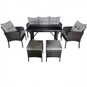 Ensemble de salle à manger moderne en rotin pour l'extérieur, comprenant trois chaises, deux repose-pieds et une table, avec un ensemble de chaises-canapés - Product Image 1