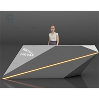 Comptoir de réception clinique dentaire moderne en pierre blanche Bureau de caissier d'angle en forme de L avec design de vague d'eau LED