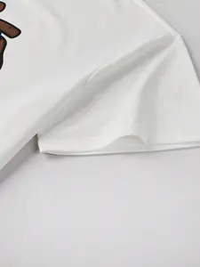 เสื้อยืดผ้าฝ้าย100% โอเวอร์ไซซ์สีขาวกระเป๋าสะพายไหล่ดีไซน์ทรงครอปพิมพ์ลายกราฟิกดิจิตอล - Product Image 3