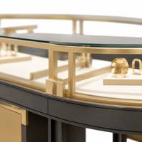 Comptoir de présentation de bijoux ovale incurvé sur mesure en acier inoxydable brossé doré avec vitrine en verre et éclairage LED intégré