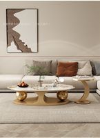 Table basse ovale en métal de style italien minimaliste moderne, luxe léger, simple, pour la maison, avec combinaison double boule latérale, très tendance