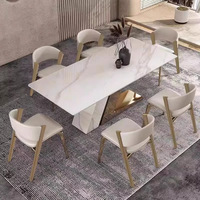 Chaise de salle à manger en acier inoxydable de style italien, luxe léger, avec dossier en cuir, design moderne pour la maison et la restauration