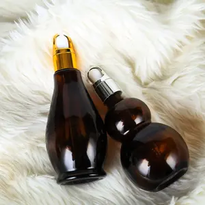 1oz 2oz 3oz amber cam şişe ile altın damlalıklı kapaklı tıbbi yağ kozmetik sıvı saç yağı cam konteyner toplu satış