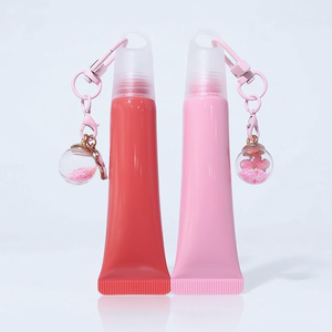 <span class=keywords><strong>Tube</strong></span> cosmétique vide en PE de 10 ml avec porte-clés Sakura flottant, <span class=keywords><strong>tube</strong></span> de baume à lèvres personnalisé avec pendentif 3D, OEM/ODM disponible - Product Image 1