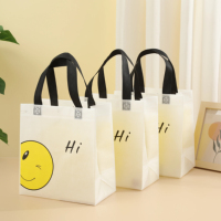 Sac de shopping réutilisable écologique sans BPA en tissu non tissé avec logo personnalisé, fermeture à bouton-pression, visage souriant, transfert thermique