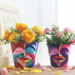 Maceta con cabeza de arcoíris abstracta al por mayor macetas con cara de grafiti macetas con drenaje macetas de flores coloridas para plantas de interior