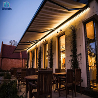 Pergola à prix de gros avec structure en alliage d'aluminium, voile en acrylique, télécommande rétractable et éclairage LED, garantie 10 ans