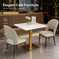Ensemble de table à manger en marbre de luxe moderne avec base dorée et chaises rembourrées pour hôtel, restaurant, café, salle à manger