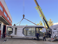 Maison préfabriquée de luxe moderne de type capsule spatiale Modulo Casa avec plateforme, sortie d'usine de haute qualité, pour villa, hôtel.