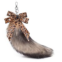 Promotion : Porte-clés queue de renard véritable 40 cm avec nœud imprimé léopard, breloque de sac en fourrure moelleuse, pendentif pour sac à dos