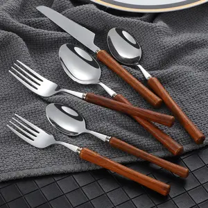 Offre Spéciale manche en palissandre japonais 304 fourchette et cuillère en acier inoxydable ensemble de couverts couteau à Steak fourchette cuillère à Dessert couverts en argent