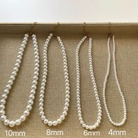 Bijoux personnalisés simples minimalistes collier de perles arrondies perles de coquillage blanc audacieux collier ras du cou et ensemble de bracelets pour hommes