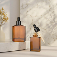 Flacon compte-gouttes rectangulaire en verre ambré 30ml 50ml 100ml pour huiles essentielles, sérums de soin et gouttes pour les yeux, avec impression de logo personnalisée