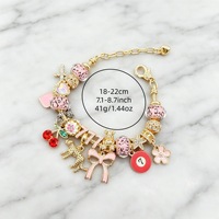 Bracelet porte-bonheur plaqué or tendance avec breloques croix, cerise, léopard, nœud, 7 fleurs rouges et étoile, bijou porte-bonheur