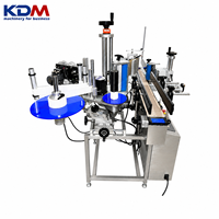 Machine d'étiquetage de bouteilles rondes en ligne à grande vitesse KDM-AL150C pour les lignes de boissons, de vin et d'eau