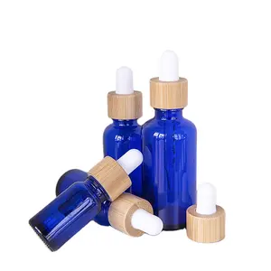 Prezzo ragionevole contenitore cosmetico bottiglia di olio essenziale 30 Ml bottiglia di vetro blu con contagocce in legno