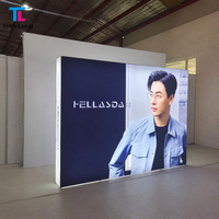 Mur d'affichage rétroéclairé pliable en tissu Pop-up avec graphiques SEG tendus et cadre modulaire en aluminium pour stand de branding événementiel