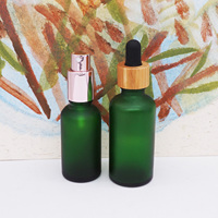 Flacon compte-gouttes d'huile essentielle vert givré cosmétique rond vide de 50ml 100ml avec bouchon en bambou