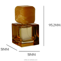 Conception de niche bouteille de parfum transparente jaune bouteille en verre de 50ml avec bouchon en pierre de couleur assortie boîte-cadeau personnalisée