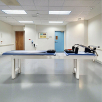 Lit et table de traction lombaire et cervicale pour la rééducation hospitalière