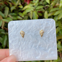 1 paire de clous d'oreille plaqués or 18 carats en cuivre de conque d'étoile de mer de style marin de style vintage