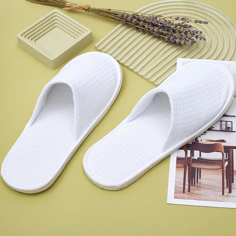 Commercio all'ingrosso personalizzato per le pantofole usa e getta dell'hotel delle cialda lavabili degli splippers della stazione termale dell'hotel