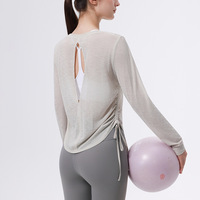 Blouse de sport pour femme en polyester 100% respirant, micro-transparente, dos creux, à lacets, à manches longues, pour le yoga