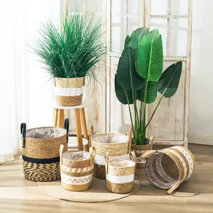 Venta al por mayor 22*21cm cesta de paja tejida cáscara de maíz natural hecho a mano almacenamiento planta cesta con asas