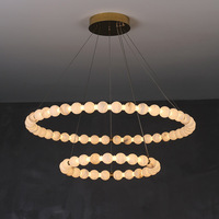 Lustre moderne en laiton et marbre alabastro, luminaire suspendu à anneaux flottants multi-niveaux pour villa, hall d'hôtel, salon